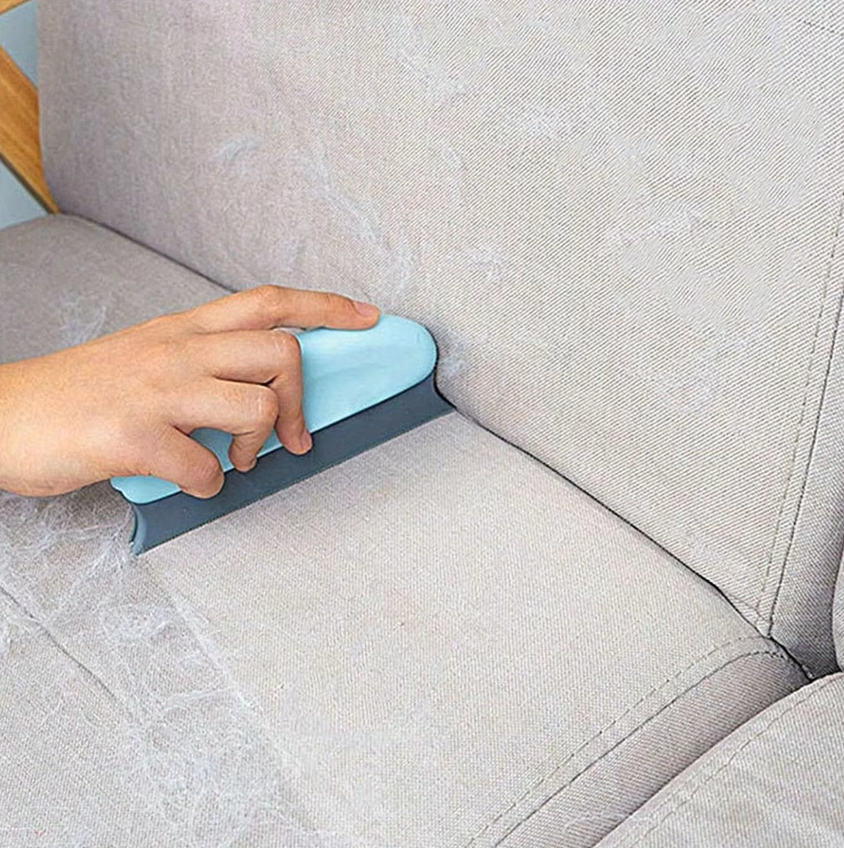 Portable pet hair remover with a travel-friendly design, perfect for quick touch-ups on clothing care.