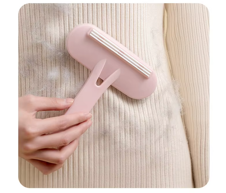 Reusable pet hair remover roller for clothing, furniture & car interiors, red handle, sticky silicone.