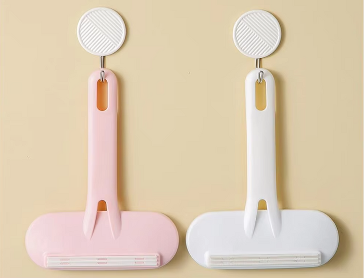 Set of reusable pet hair remover rollers, one large for home, one travel size for on-the-go garment care.