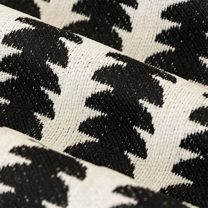 Close-up of soft chenille fabric sofa cover, showing textured anti-scratch surface, ideal for pet owners and home decor.