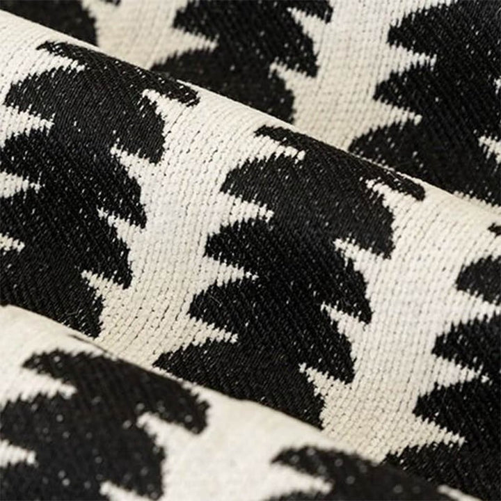 Close-up of soft chenille fabric sofa cover, showing textured anti-scratch surface, ideal for pet owners and home decor.