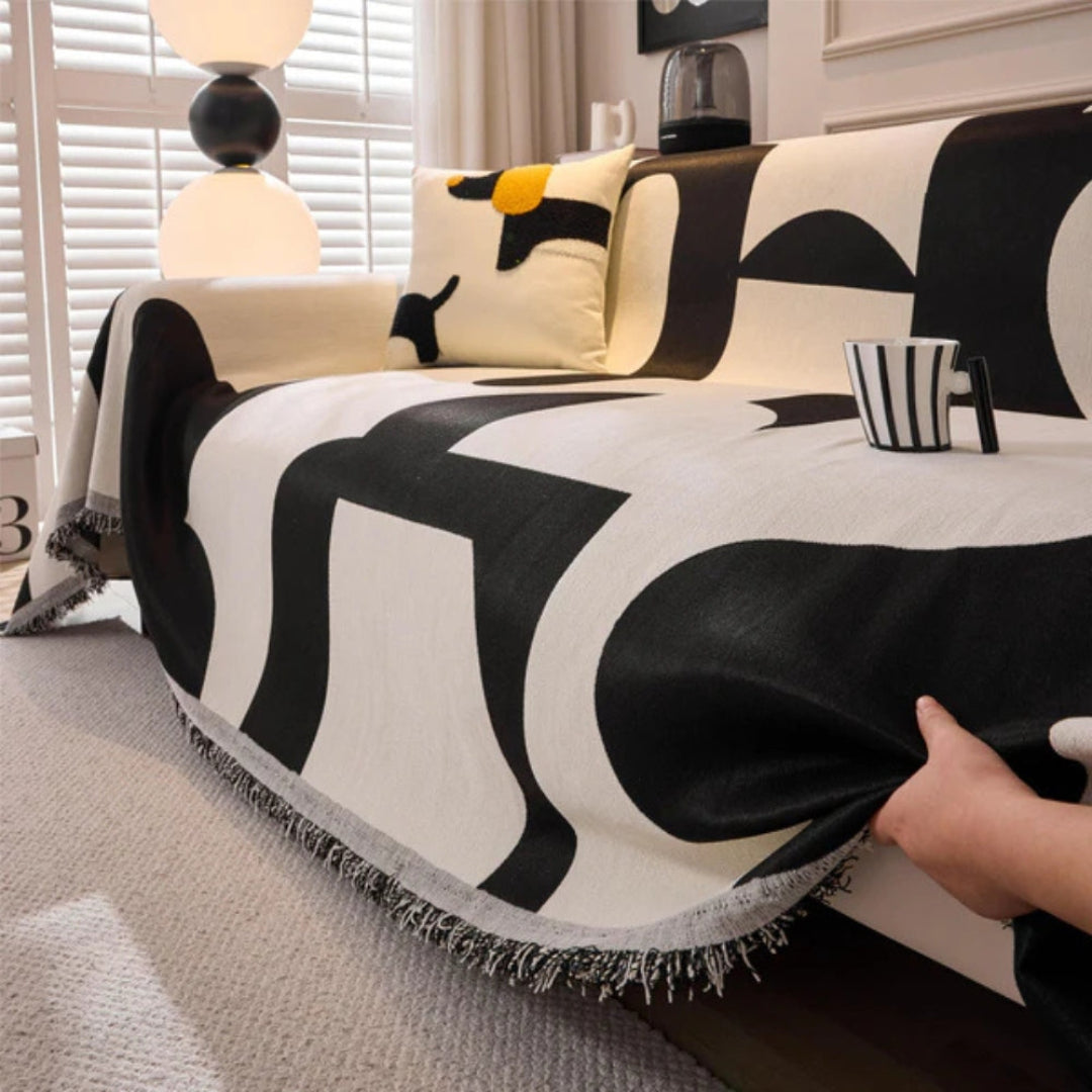 Machine washable chenille sofa cover, an excellent, durable, and reversible option with tassels for modern homes.