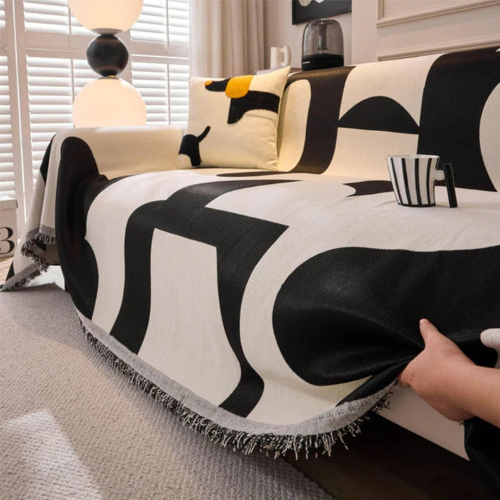 Machine washable chenille sofa cover, an excellent, durable, and reversible option with tassels for modern homes.
