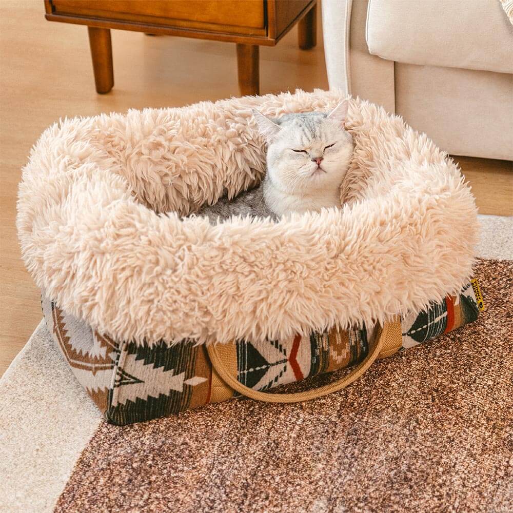 All-season pet snuggle bed showing its reversible fabric, a versatile carrier and cozy bed for dogs and cats.