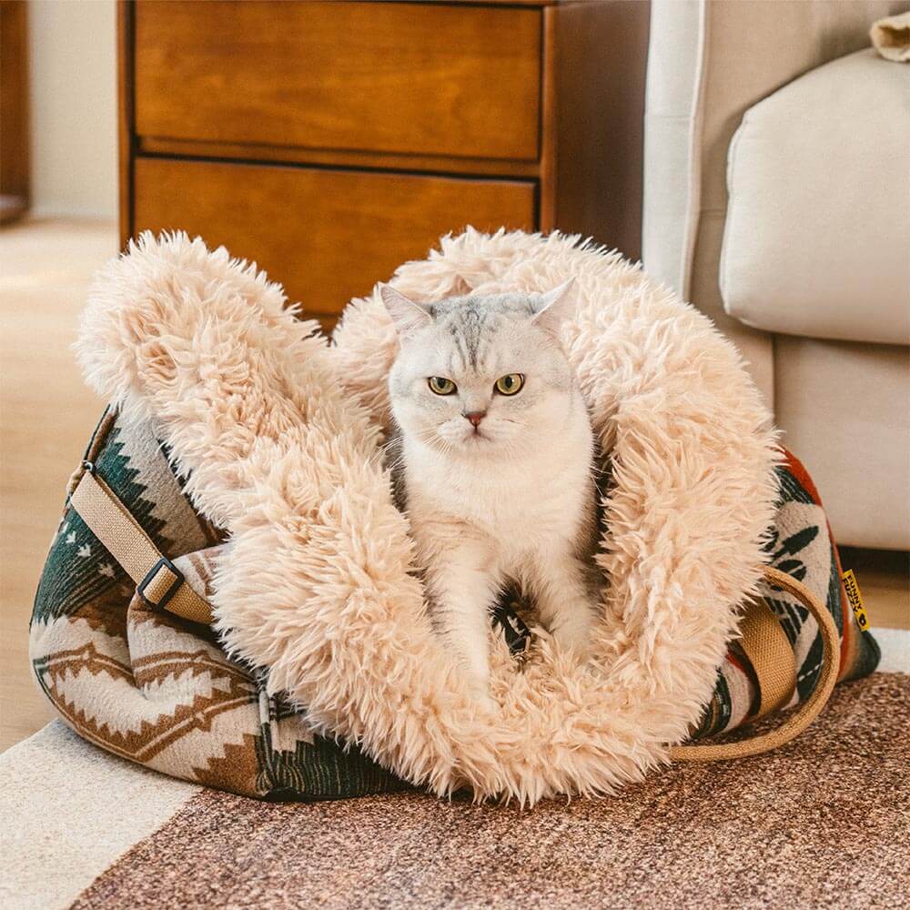 Portable travel pet carrier and reversible bed, designed for dogs and cats to snuggle in all seasons.