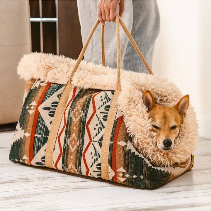 Unisex pet carrier converts to all-season dog bed, featuring a cozy snuggler design for comfortable pet travel.