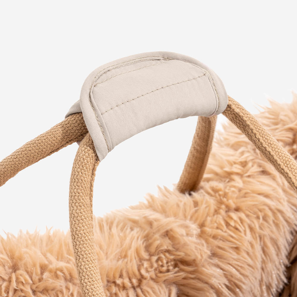 Empty reversible pet carrier, highlighting its sturdy construction and indie boho pattern, an all-season pet bed.