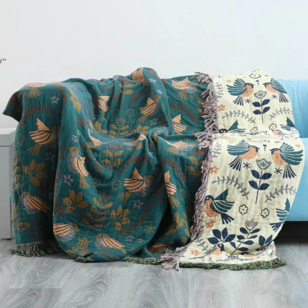 Cozy unisex Scandinavian bird pattern cotton throw, perfect reversible blanket for stylish home decor.