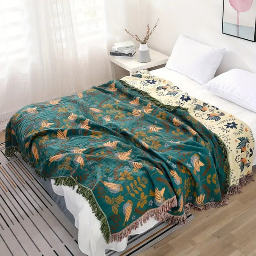 Reversible Scandinavian throw blanket with bold bird pattern, perfect for Nordic style home decor.
