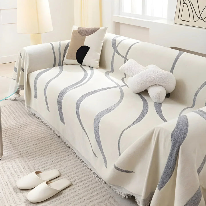Pet friendly reversible sofa protector in warm khaki and cool gray for versatile home decor