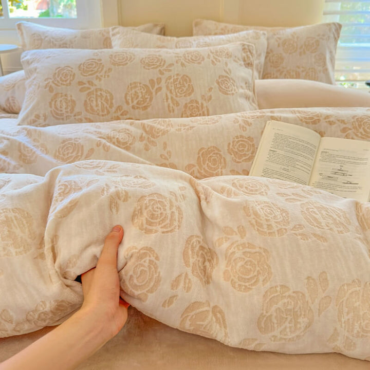 Soft rose velvet sheet set featuring intricate carved patterns, luxurious bedroom comfort.