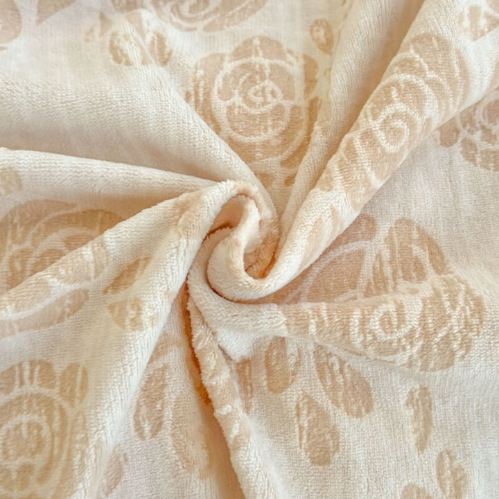 Rose velvet bedding set with ornate carved design, ideal for a plush and cozy bedroom.