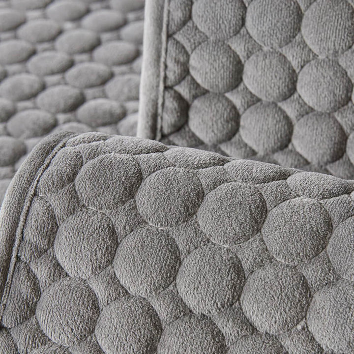 Moisture-absorbent round quilted suede sofa protector for living room furniture