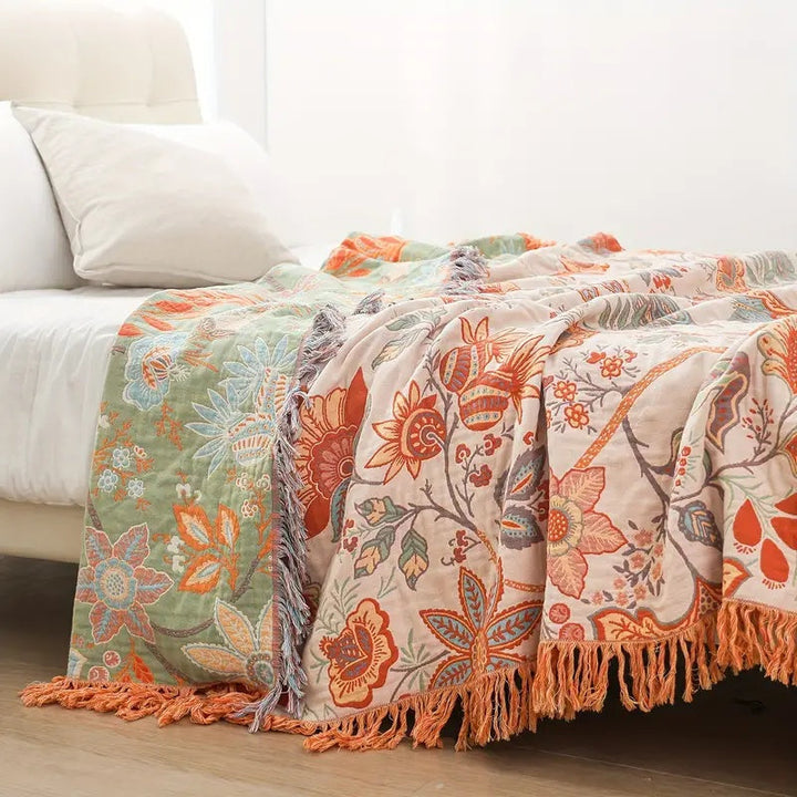 Soft 100% cotton boho throw blanket with a rustic floral pattern, ideal for bohemian home accents.
