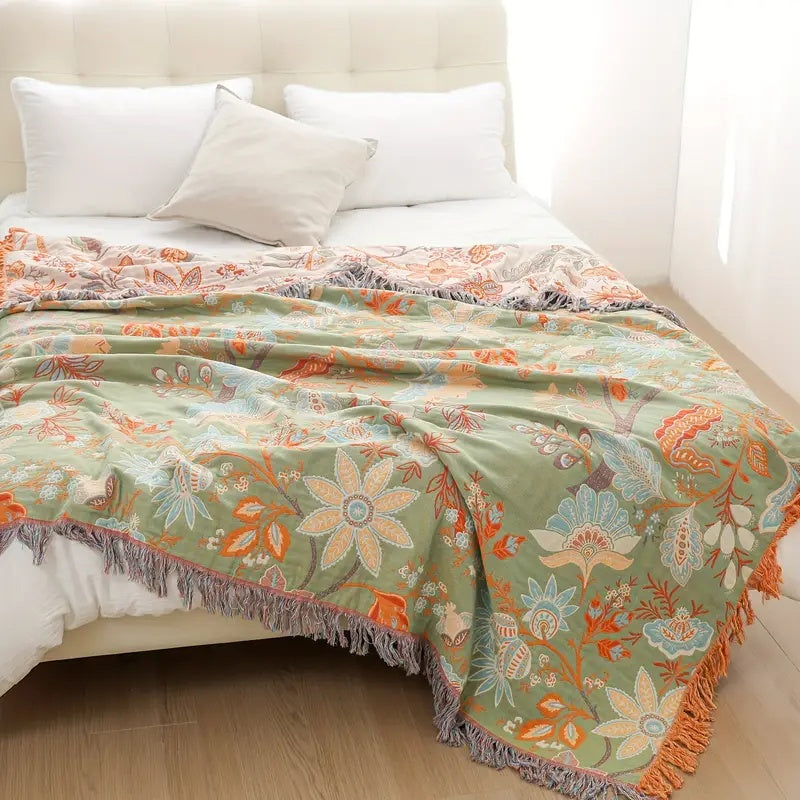Hand-woven 100% cotton rustic floral throw, perfect for cozying up your living space.