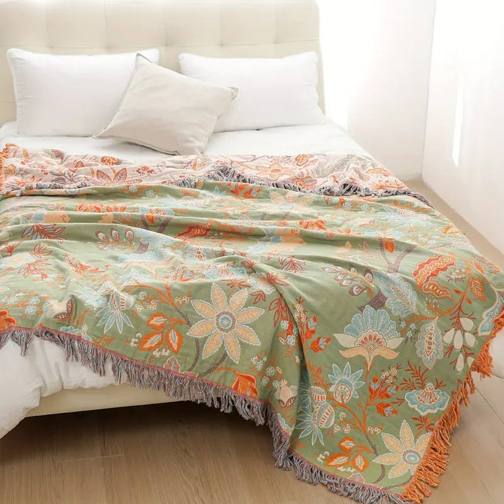 Hand-woven 100% cotton rustic floral throw, perfect for cozying up your living space.