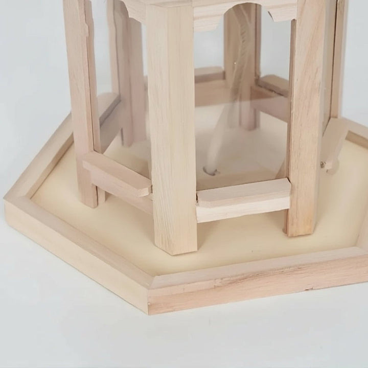 Durable handmade wooden birdhouse with an integrated water system, providing a safe haven for garden birds. Rustic charm.