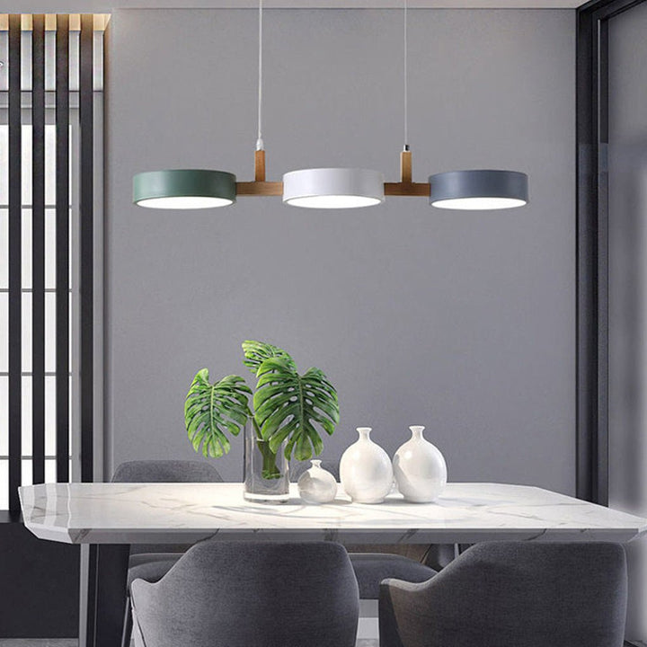 Close-up of sleek Scandinavian LED pendant lamp, adjustable warm glow, showing contemporary ceiling fixture.
