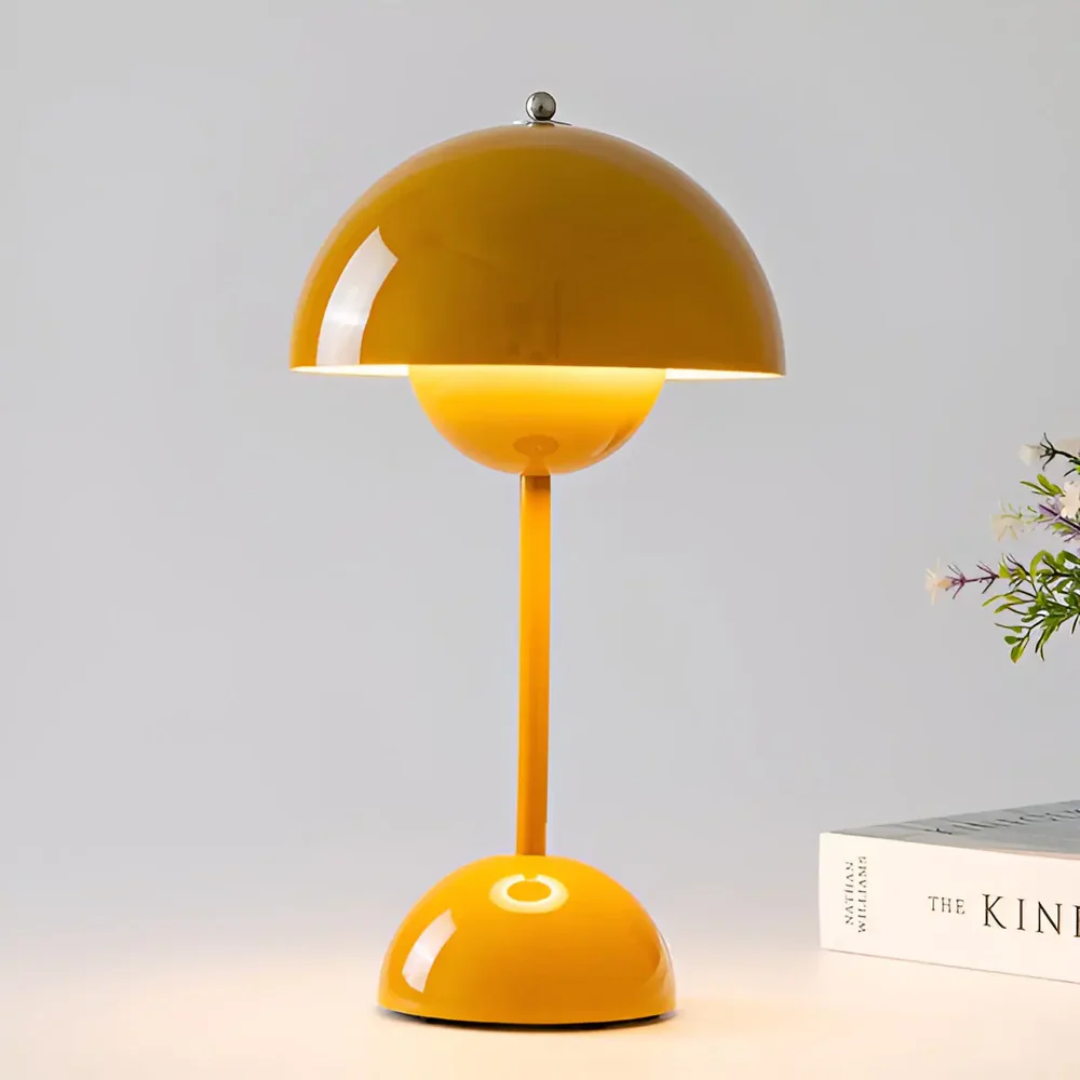 Wireless table lamp providing adjustable accent lighting for a cozy bedroom or living room.