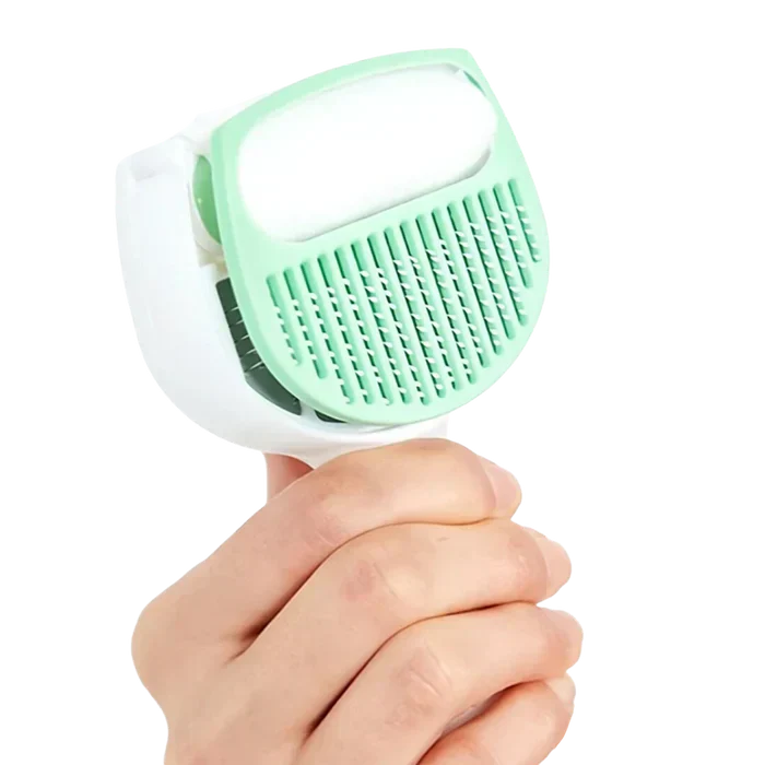 Ergonomic pet grooming brush designed for comfortable handling during dog and cat shedding
