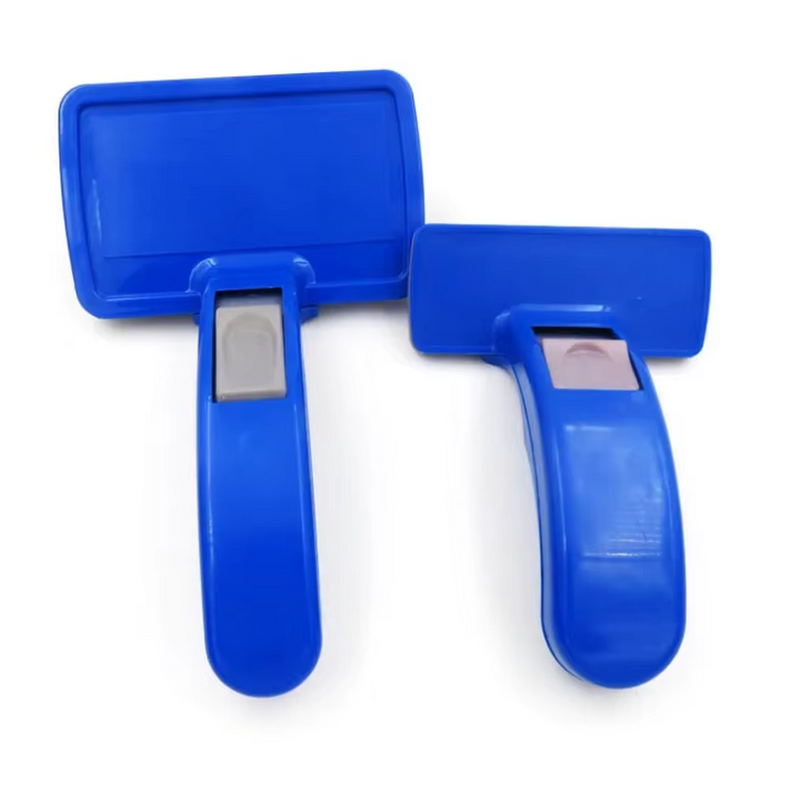Ergonomic pet brush for dogs and cats featuring self-cleaning function and soothing silicone bristles