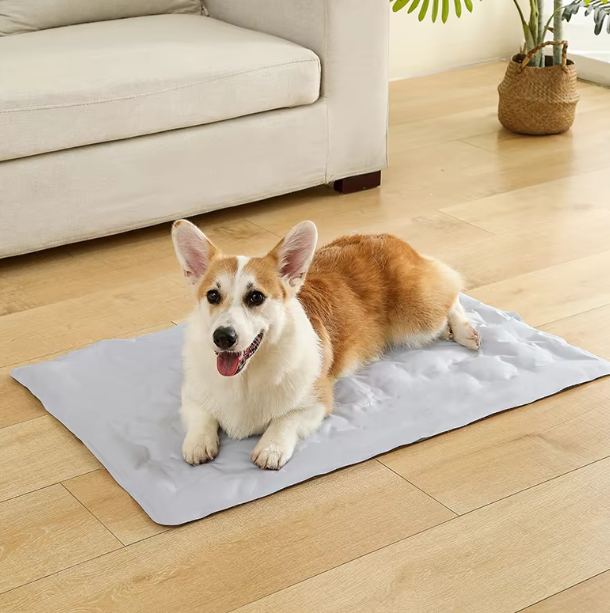 Blue rectangular pet cooling mat with gel, designed for dog and cat comfort in hot weather