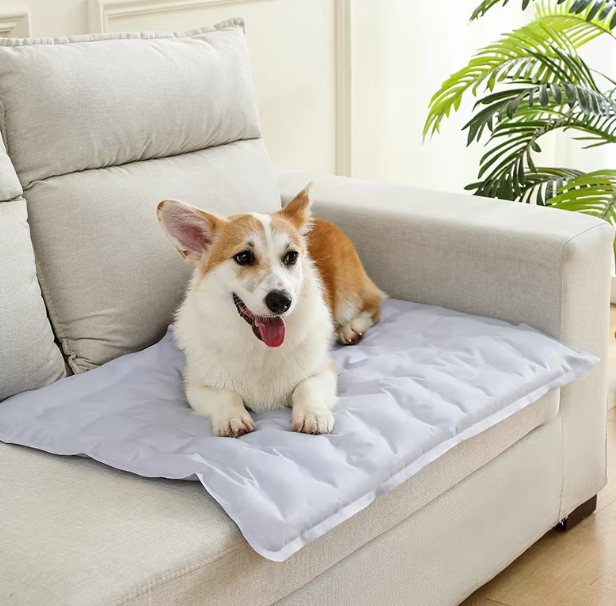 Dog sleeping soundly on a self-cooling gel mat, showcasing pet comfort and heat relief