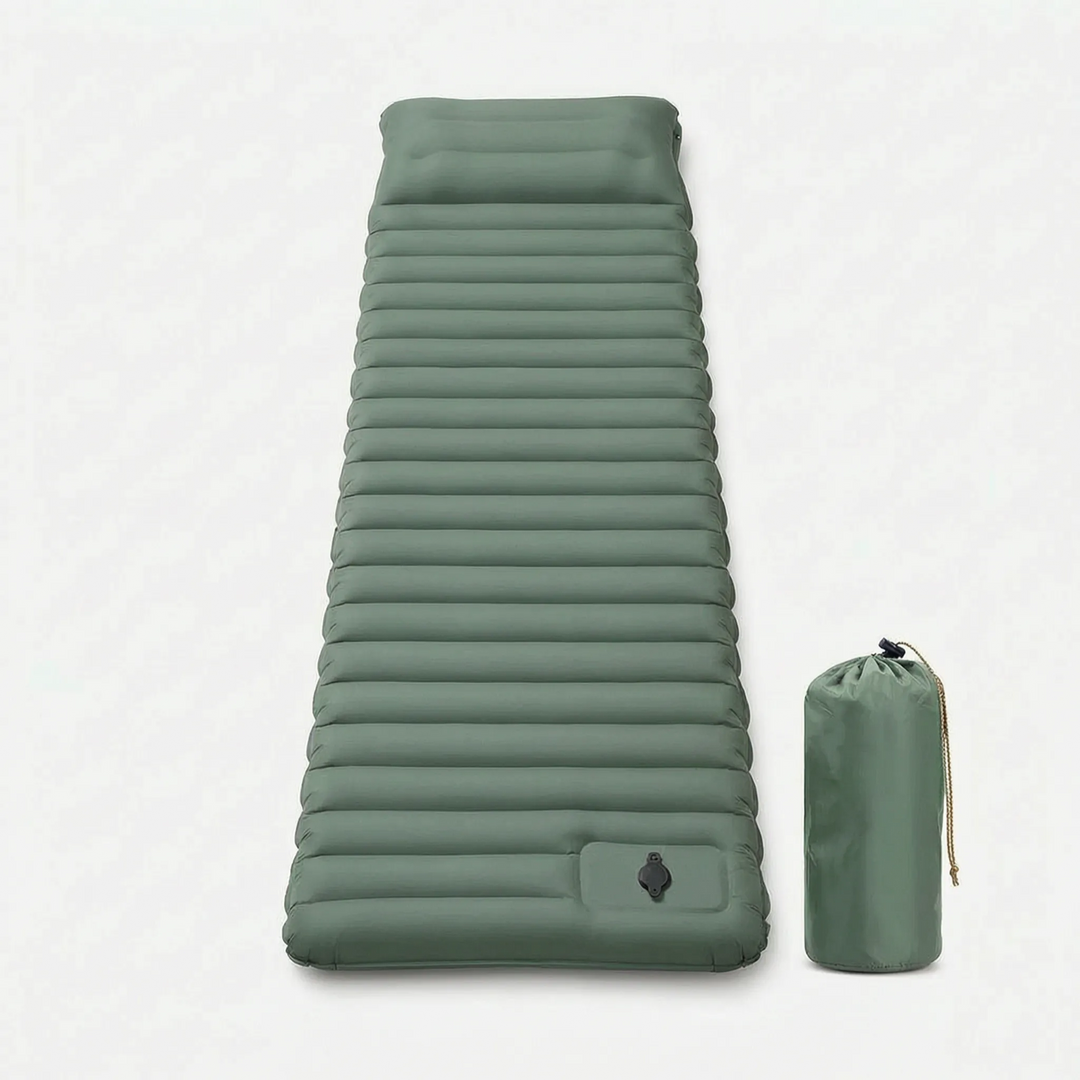 Person relaxing on a blue self-inflating camping sleeping pad outdoors. Perfect for hiking & outdoor comfort.