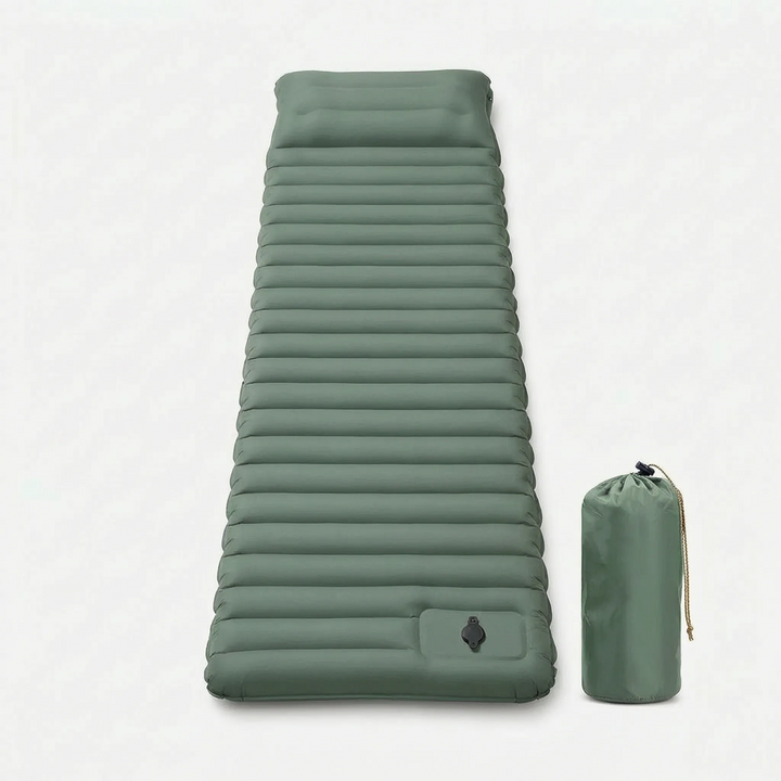 Person relaxing on a blue self-inflating camping sleeping pad outdoors. Perfect for hiking & outdoor comfort.