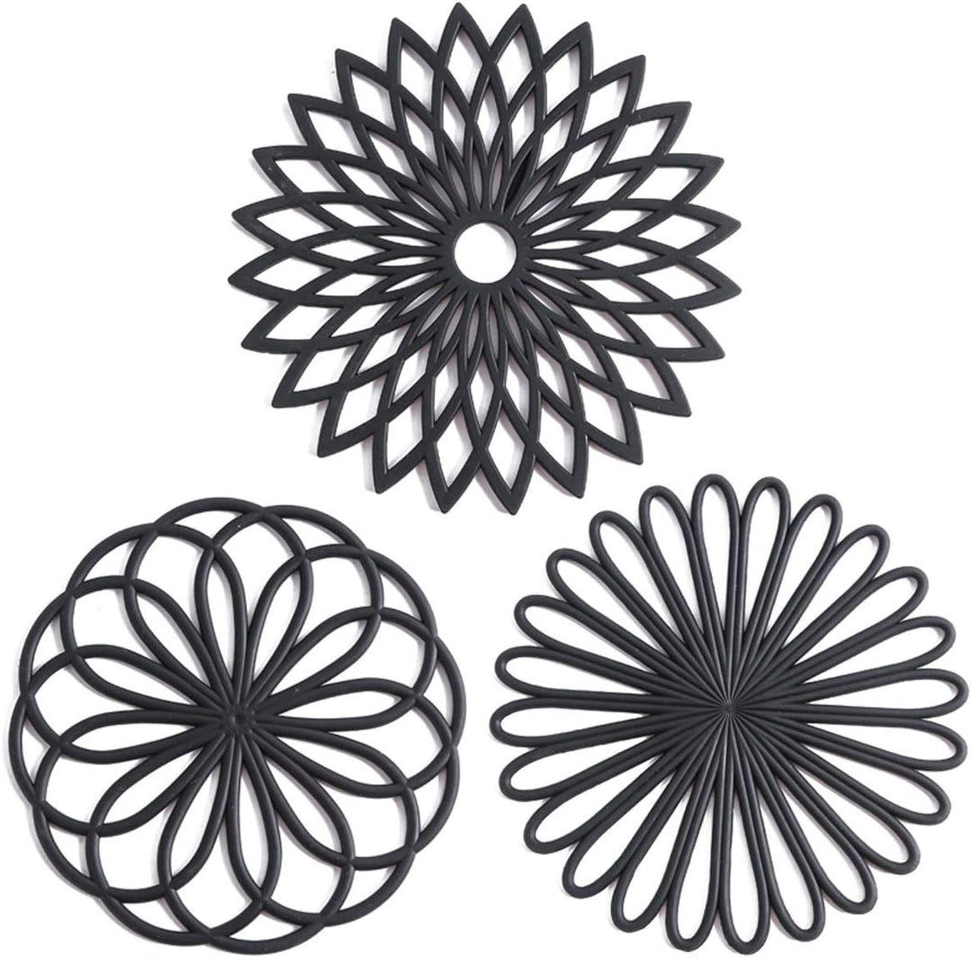 Set of 3 silicone heat-resistant coasters protecting tables from hot pots & drinks.