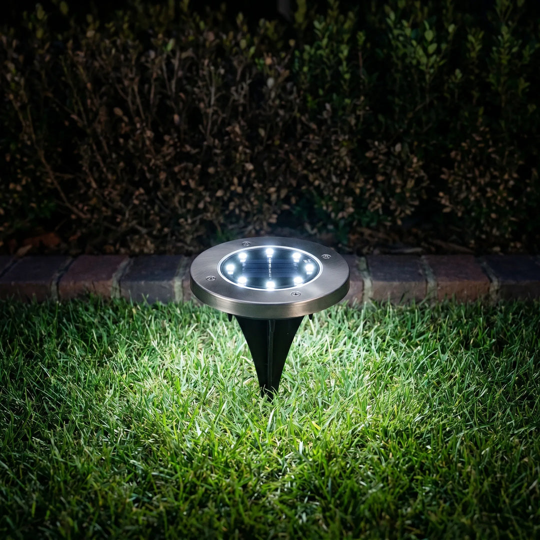 Durable, waterproof solar disk lights with LED illumination for garden pathways. Eco-friendly, wireless in-ground lighting.