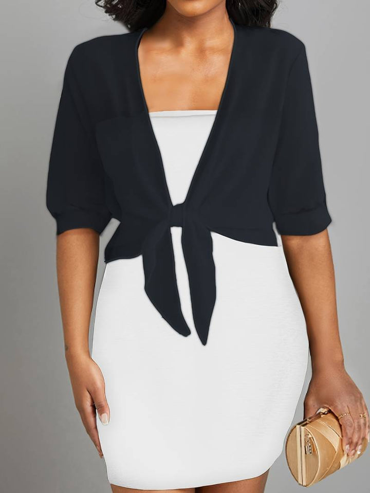 Versatile women's sheer cropped top. Tie-front bolero, half-sleeve design for elegant or casual chic layering.
