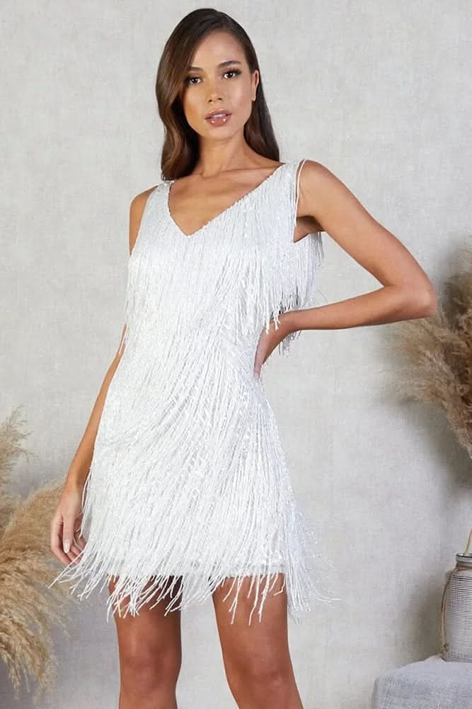 Close-up of shimmering A-line fringe dress, highlighting sequin texture and elegant flow. Women's party wear.