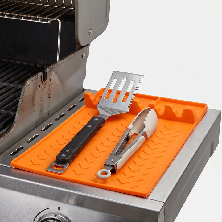 Durable silicone drip tray for grill utensils. Prevents messy spills & keeps BBQ area spotless.