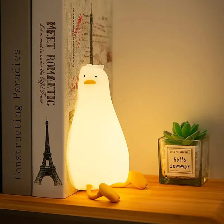 Dimmable silicone animal night light for peaceful kids' sleep, rechargeable, soft glow.