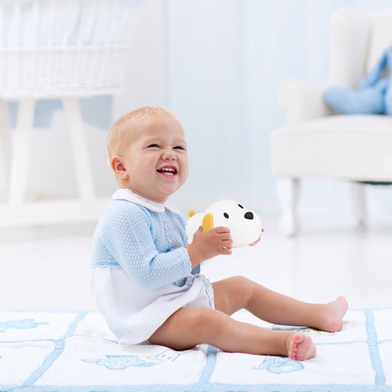 Soft glow silicone night light, sleep aid for children, perfect nursery decor, child safe.