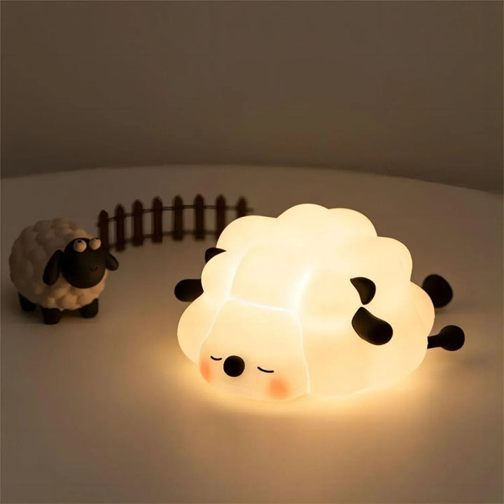 Rechargeable kids' silicone night light, dimmable for nursery, cute animal design, soft glow.
