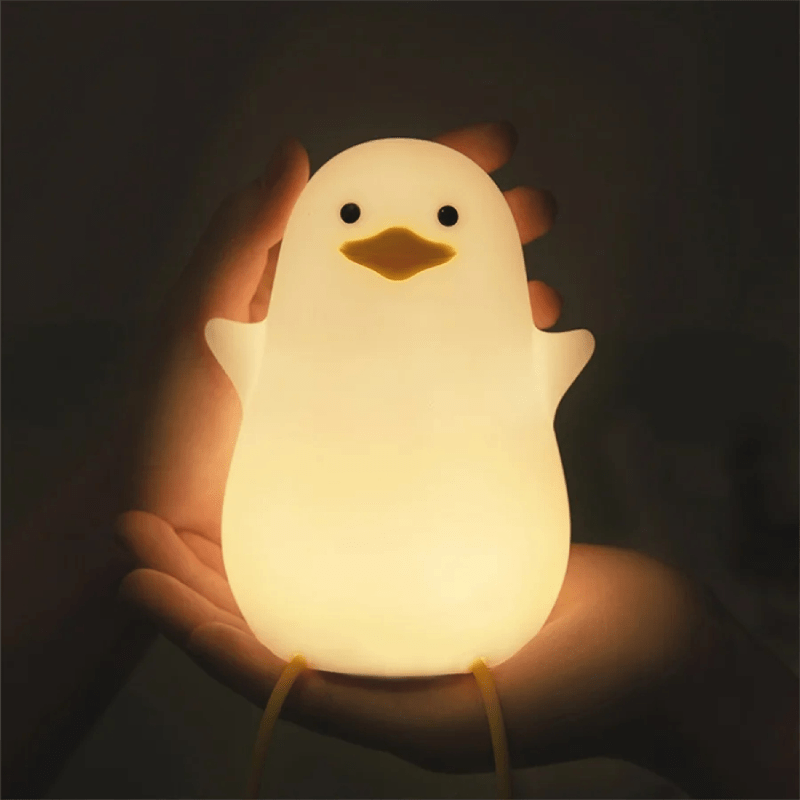Kids' dimmable silicone night light, animal shape, gentle glow for nursery decor & sleep.