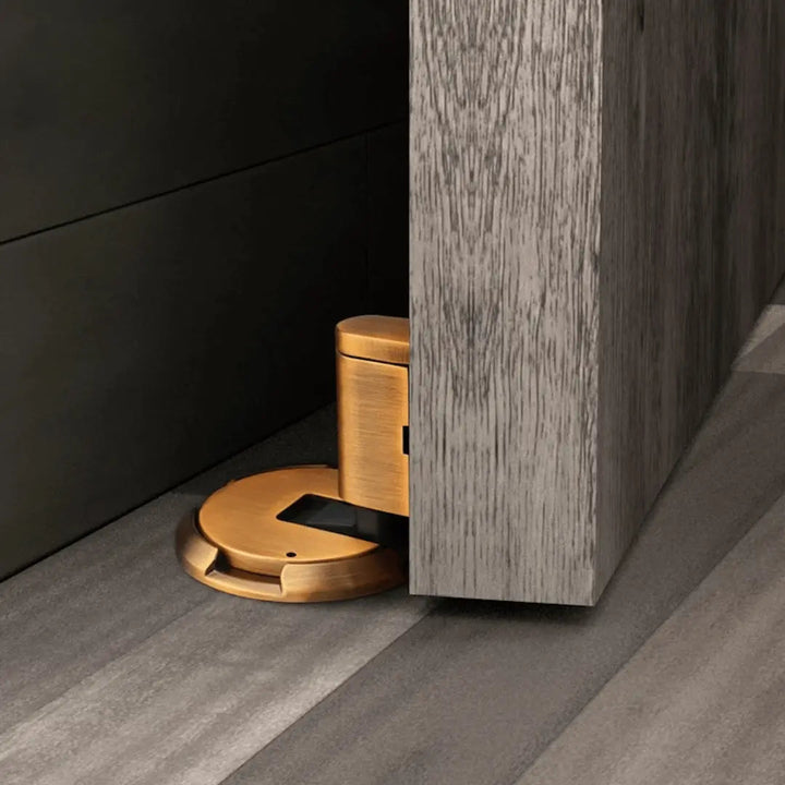 Modern bronze magnetic door holder, no-drill design for silent operation and home safety, protects walls.