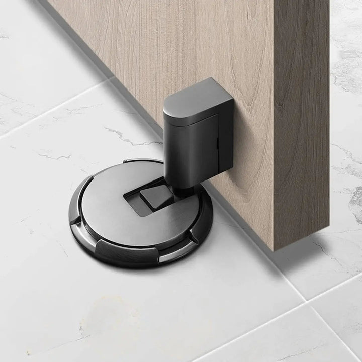 Versatile no-drill magnetic door holder in black, protects walls and keeps doors open securely and silently.