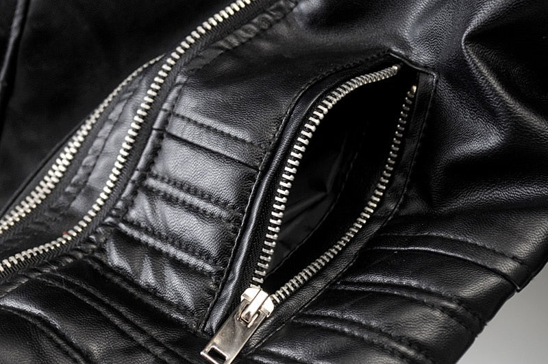 Everyday black women's biker jacket. This fashionable and sleek outerwear offers a contemporary, fitted style.