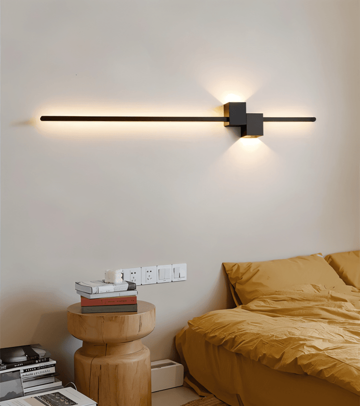 Sleek LED wall light, modern minimalist design, offers warm ambient indirect lighting for any room.
