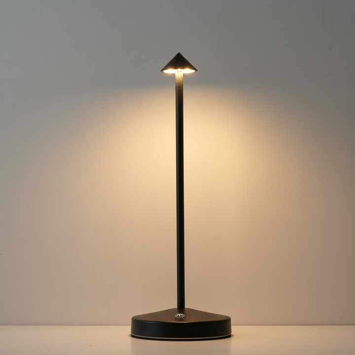 Minimalist aluminum LED table lamp with a rechargeable battery, perfect for stylish accent lighting.