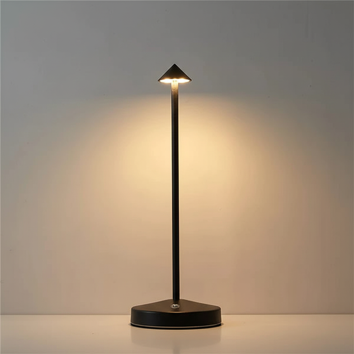 GlowArrow portable LED table lamp, modern aluminum design, offering warm, relaxing ambient light.