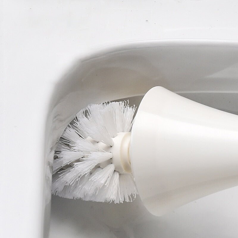 Minimalist toilet brush with a long handle and hygienic silicon head, great for modern bathroom organization.