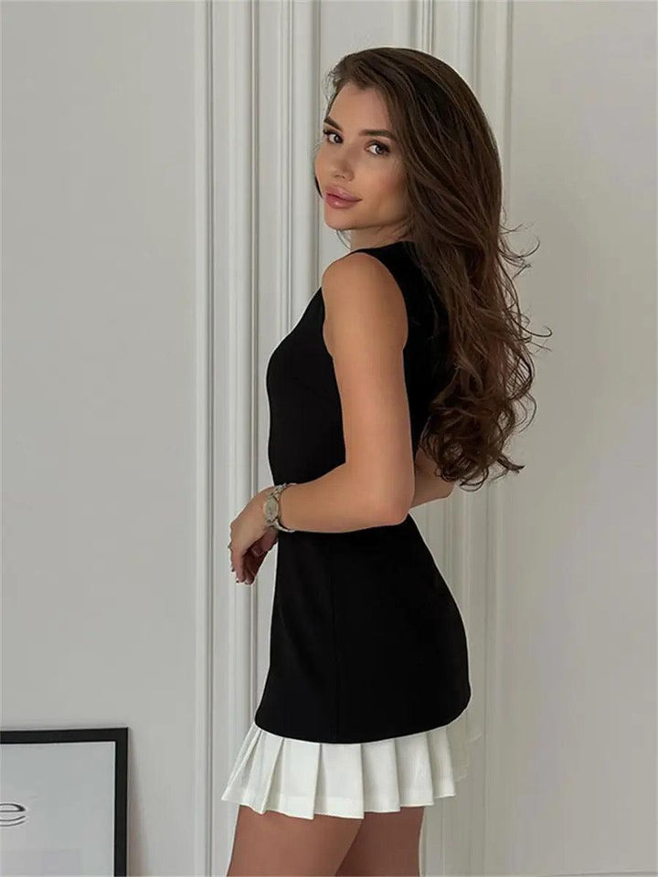 Chic sleeveless women's mini dress featuring a striking contrast pleated hem. Versatile for casual or party.