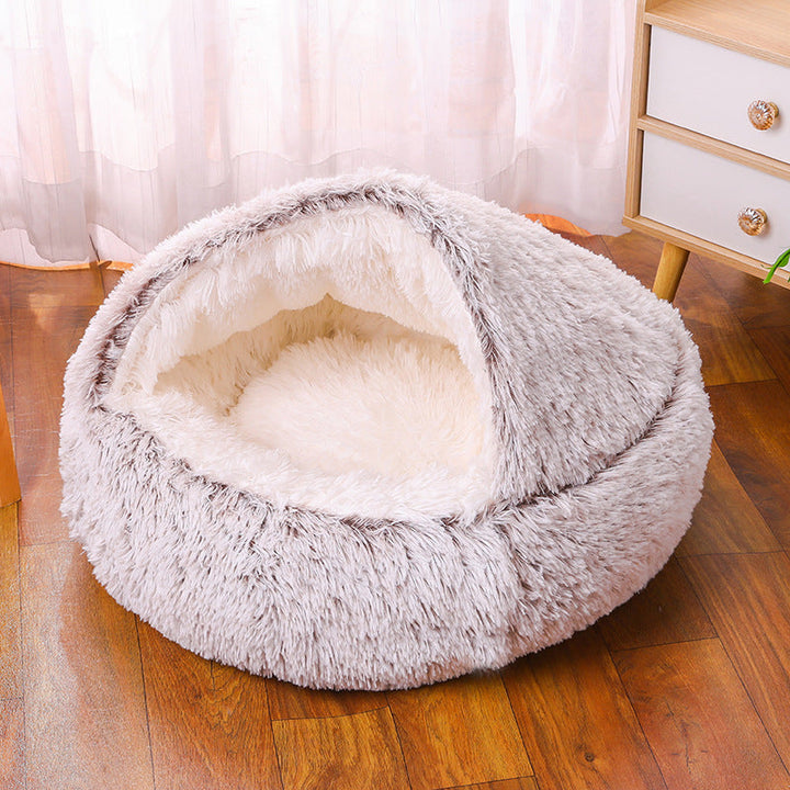 Self-warming faux fur dog bed, half-cave style, shown with ample space for a small dog to relax and burrow.