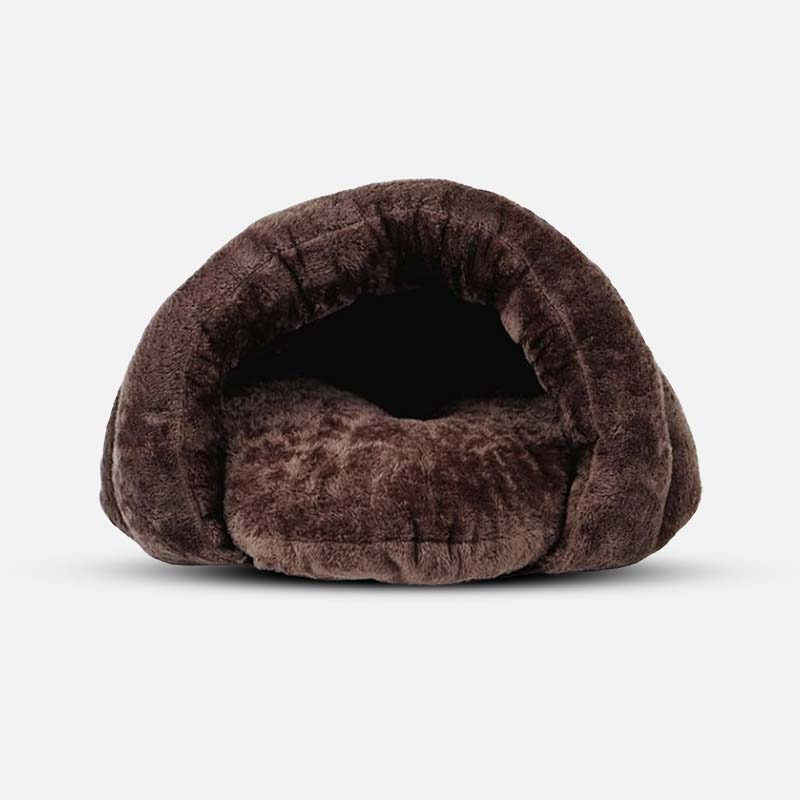 Small dog calming cave bed with soft faux fur for anxiety relief and cozy pet comfort.