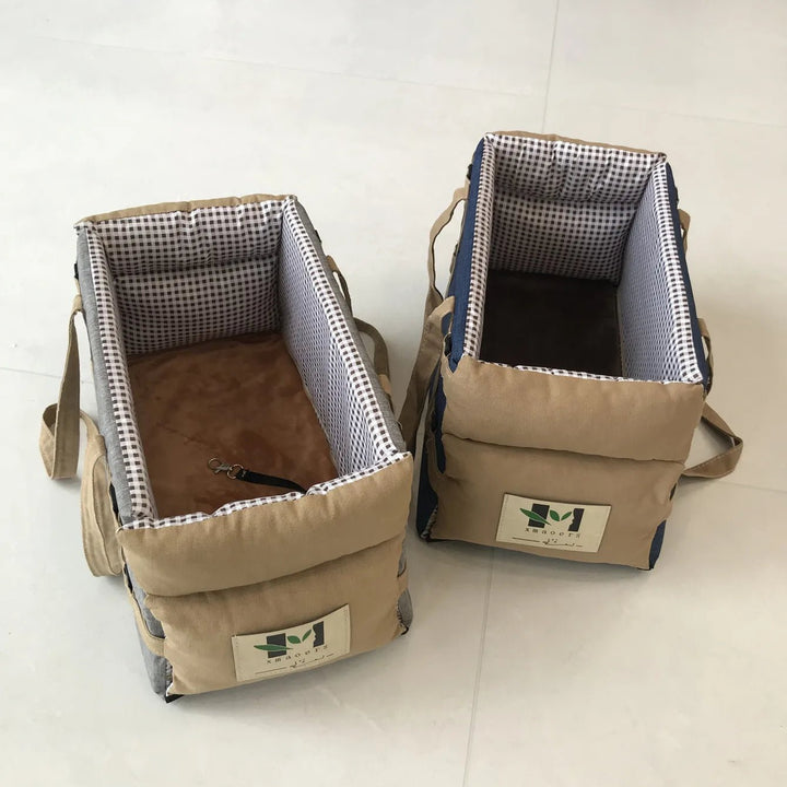 Small dog travel car seat with easy-to-install straps and breathable sides for pet comfort.