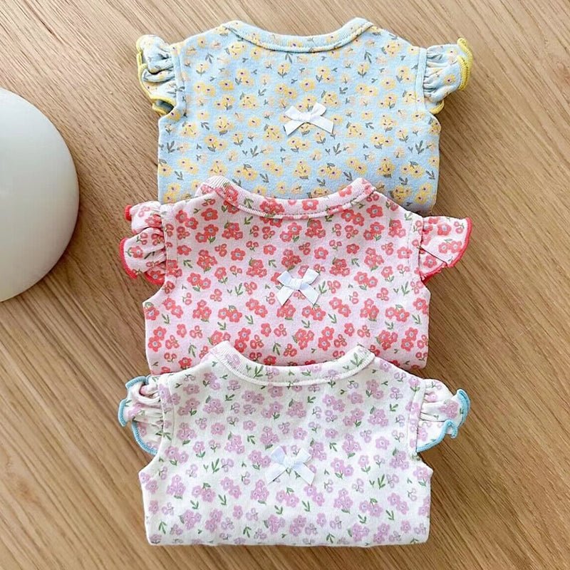 Pet dog wearing a vibrant floral vest, ideal for small dog apparel and outdoor comfort.